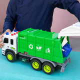 A child's hands and torso are visible as they play with a toy garbage truck. 